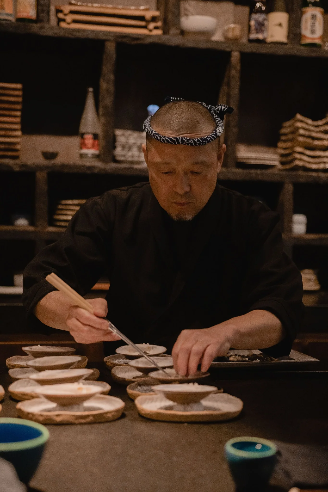 Kuu Jū — chef plating at the counter
