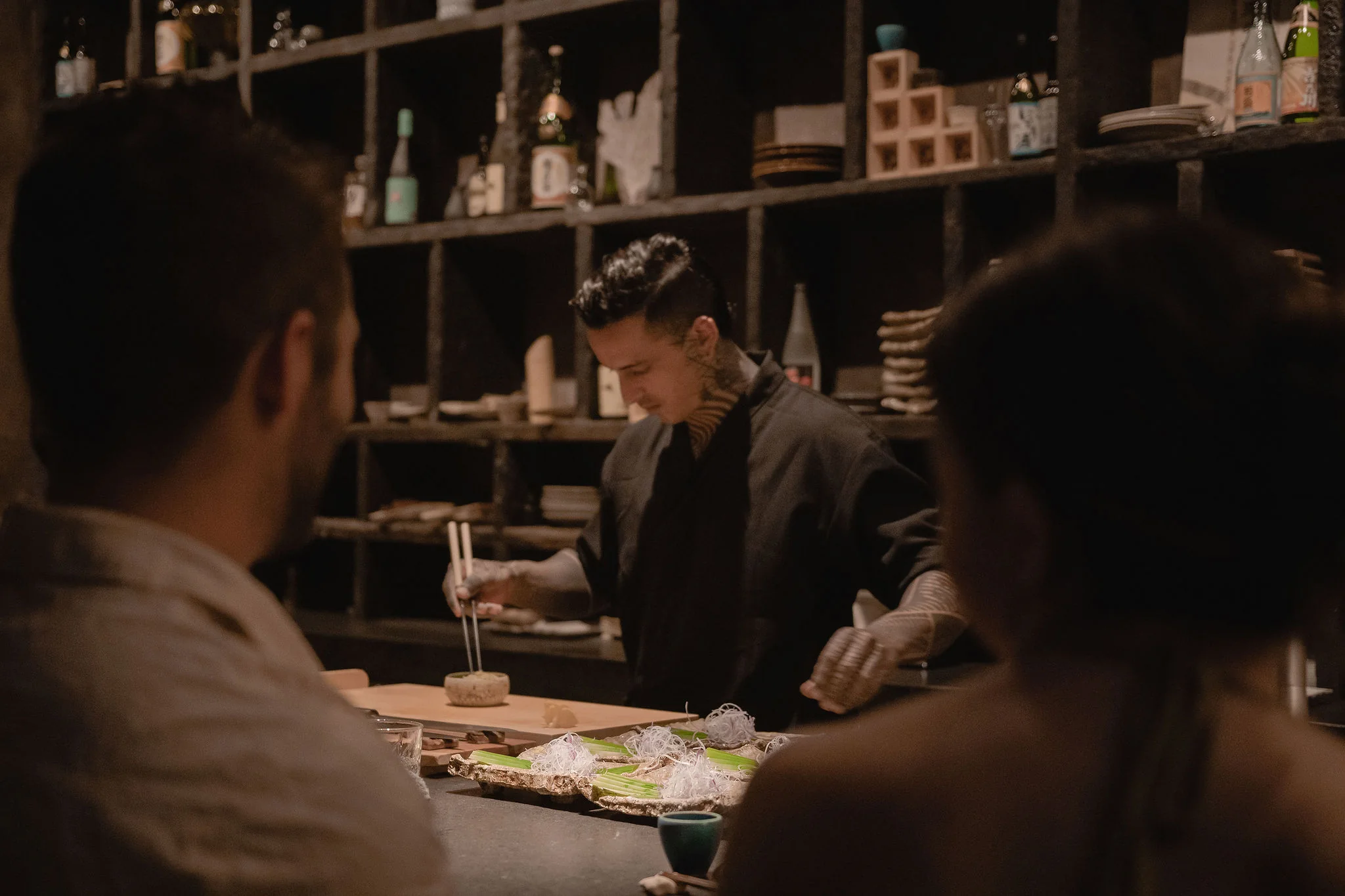Kuu Jū — chef serving guests at the counter
